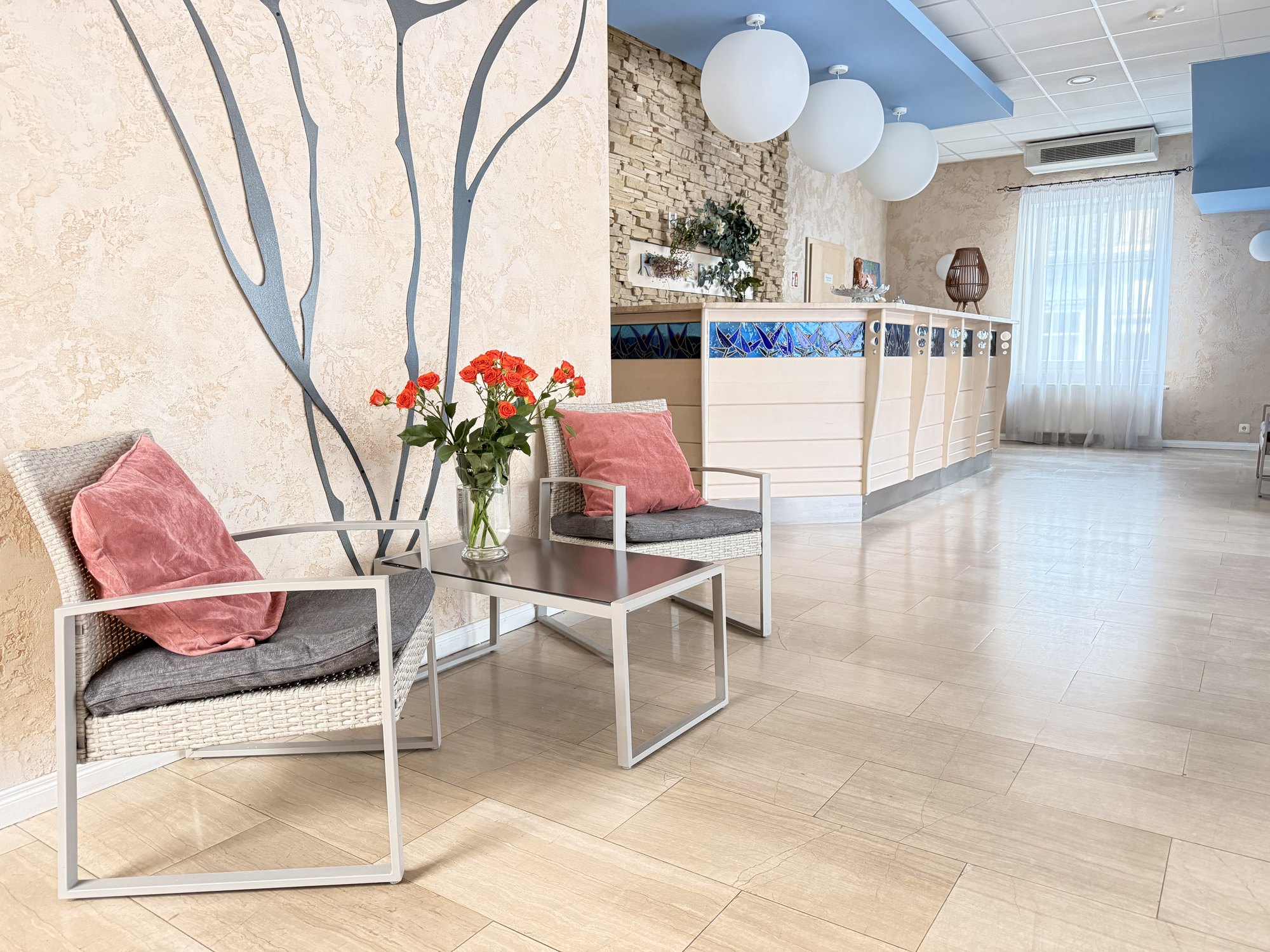 Reception and lobby at Lucky Fish Jūrmala with warm wood and pendant lighting