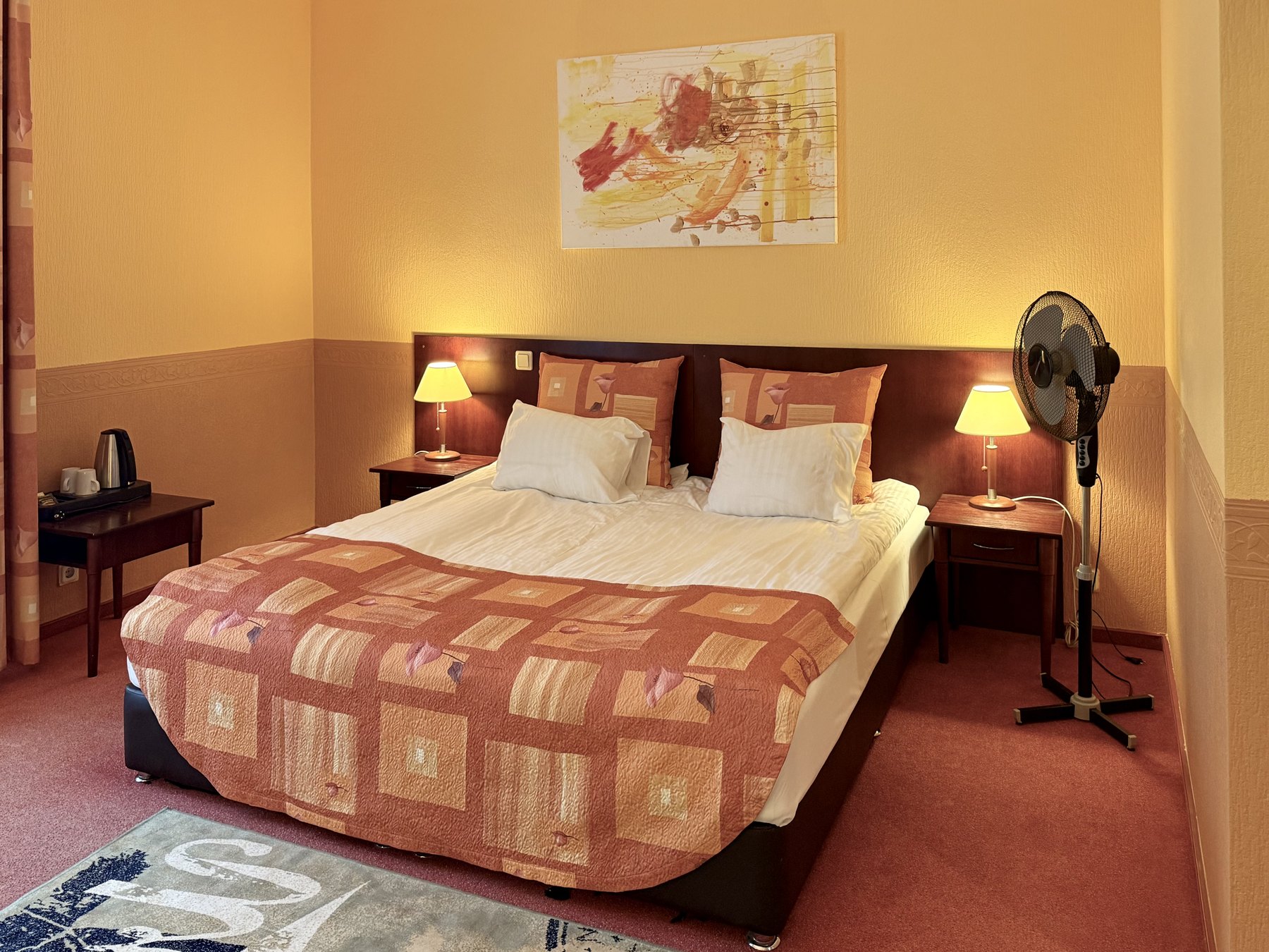 Triple Room at Lucky Fish Jūrmala with three beds and warm natural light